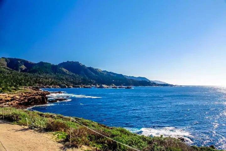 The Big Sur coastline with cliffs dropping into blue water
