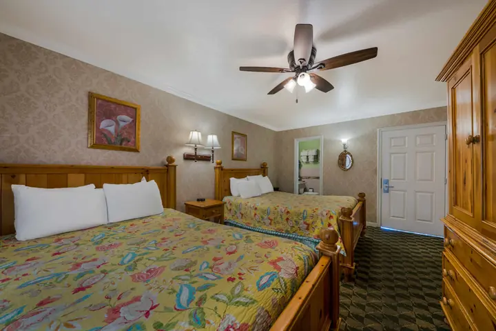 Double Queen room showing both beds, the armoire and the entry door